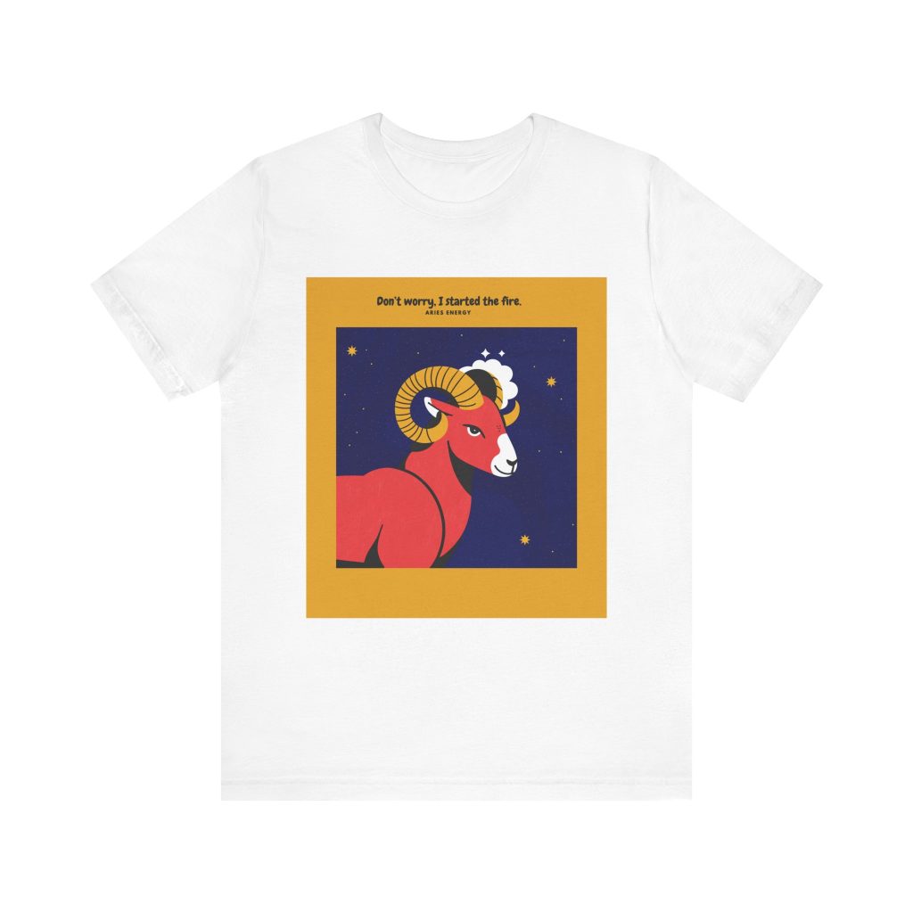 White t-shirt with a colorful Taurus zodiac illustration featuring a stylized pink bull and abstract yellow background.