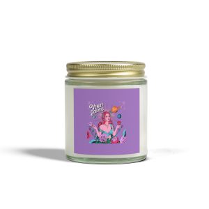 Venus-themed candle in a glass jar with a gold lid, featuring a vibrant purple label showing a galactic goddess surrounded by planets and flowers.