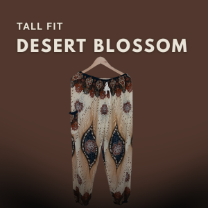 Tall fit harem pants named “Desert Blossom” displayed against a warm brown backdrop. Features a flowing cut and tribal-inspired print, designed for tall women.