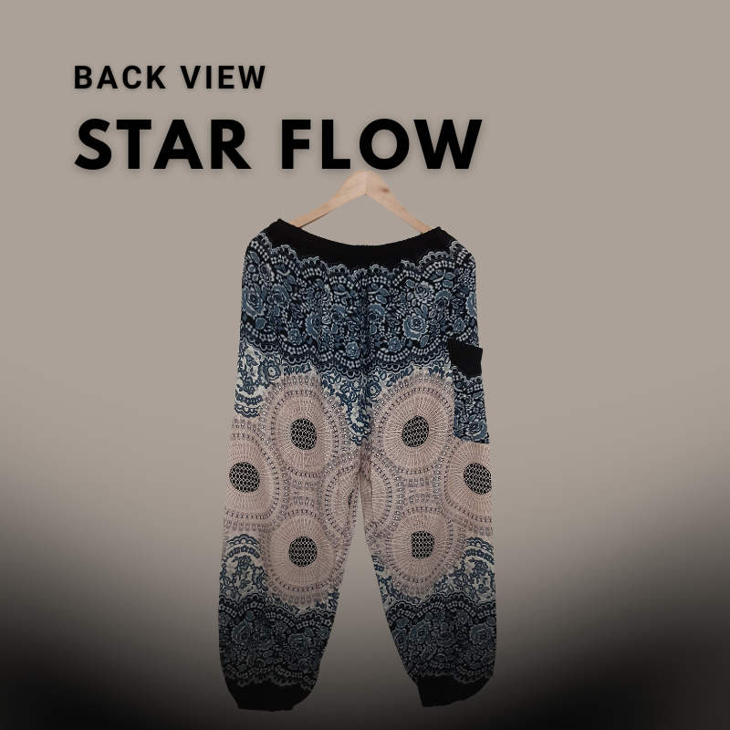 A pair of tall-fit burgundy harem pants with white elephant and paisley designs, hanging on a wooden hanger against a dark plum background with the text "Full Fit Star Flow".