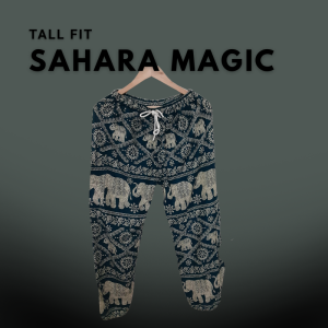 Tall fit harem pants with a navy blue and cream elephant and mandala print, hanging on a wooden hanger against a muted green gradient background.