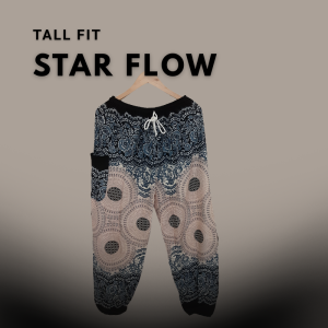 A pair of tall-fit burgundy harem pants with white elephant and paisley designs, hanging on a wooden hanger against a dark plum background with the text "Full Fit Star Flow